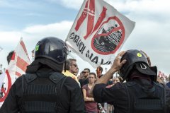 Two carabinieri in front of protesters against cruise ships in Venice